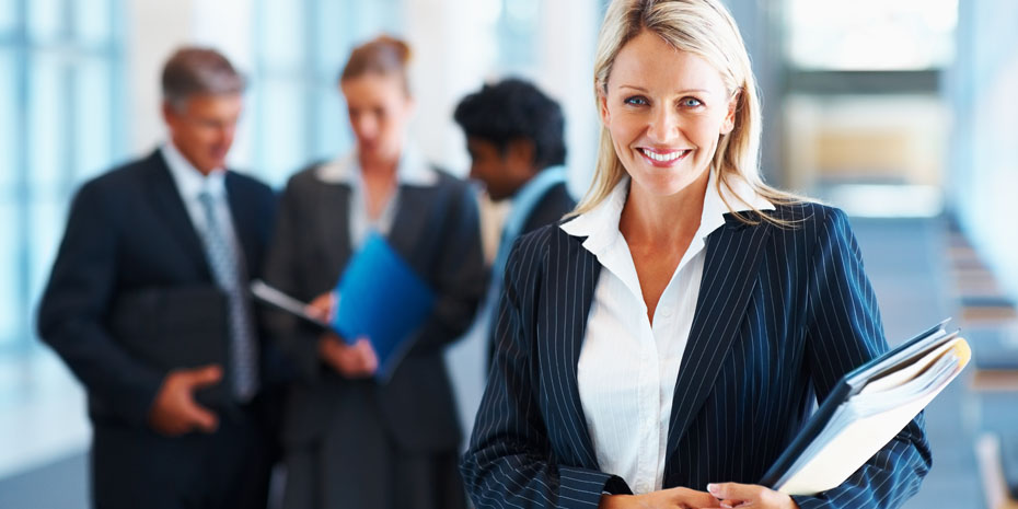 Cute business woman with colleagues in discussion at the background